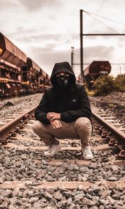 Preview wallpaper mask, hood, railroad, rails, man