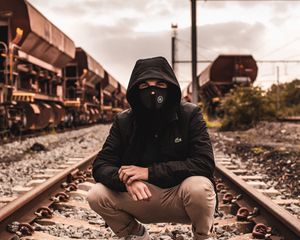 Preview wallpaper mask, hood, railroad, rails, man