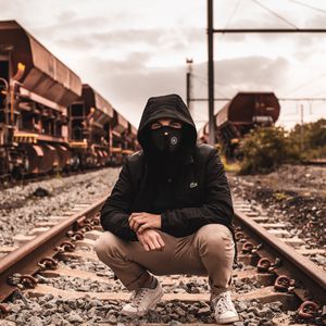 Preview wallpaper mask, hood, railroad, rails, man