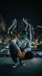 Preview wallpaper mask, man, anonymous, glow, city, street