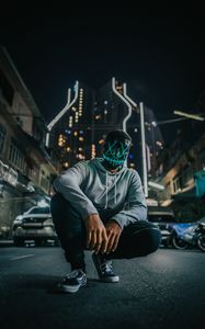 Preview wallpaper mask, man, anonymous, glow, city, street