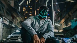 Preview wallpaper mask, man, anonymous, glow, city, street