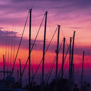 Preview wallpaper masts, silhouettes, sunset, dark