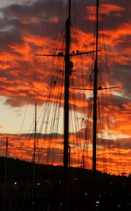 Preview wallpaper masts, silhouettes, trees, sky, evening