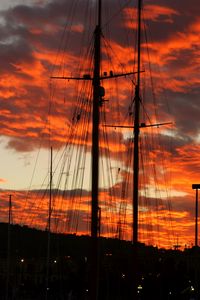 Preview wallpaper masts, silhouettes, trees, sky, evening