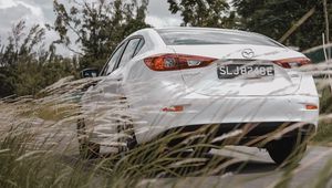 Preview wallpaper mazda 3, mazda, car, white, rear view, grass, trees