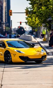 Preview wallpaper mclaren, car, sports car, yellow, parking