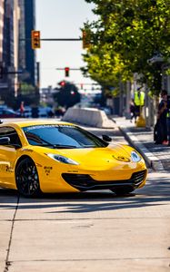 Preview wallpaper mclaren, car, sports car, yellow, parking