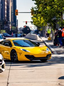 Preview wallpaper mclaren, car, sports car, yellow, parking