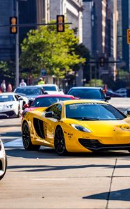 Preview wallpaper mclaren, car, sports car, yellow, road