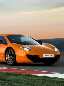 Preview wallpaper mclaren mp4-12c, track, orange, side view, twilight