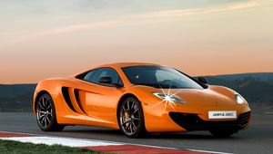 Preview wallpaper mclaren mp4-12c, track, orange, side view, twilight