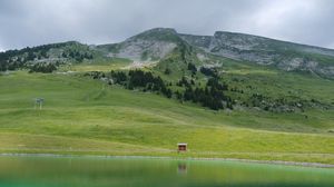 Preview wallpaper meadow, mountains, slope, grass, lake, nature