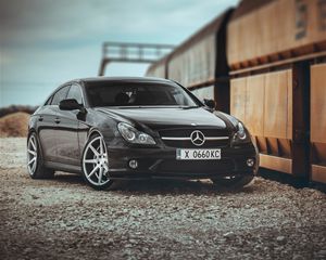 Preview wallpaper mercedes, car, black, pebbles