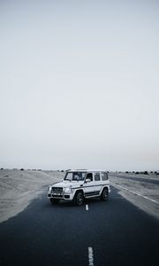 Preview wallpaper mercedes, car, suv, white, road, desert
