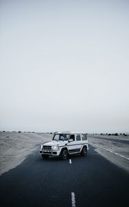 Preview wallpaper mercedes, car, suv, white, road, desert