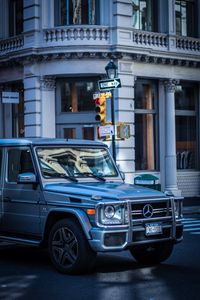 Preview wallpaper mercedes g-class, mercedes, g-wagen, suv, silver, city, movement