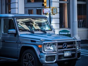 Preview wallpaper mercedes g-class, mercedes, g-wagen, suv, silver, city, movement