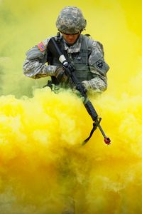 Preview wallpaper military, camouflage, weapon, rifle, smoke, yellow