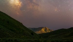 Preview wallpaper milky way, hills, grass, night