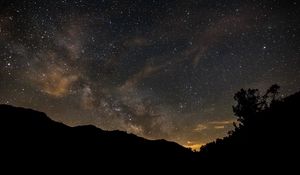 Preview wallpaper milky way, stars, night, hills, silhouettes, space