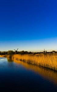 Preview wallpaper mills, grass, lake