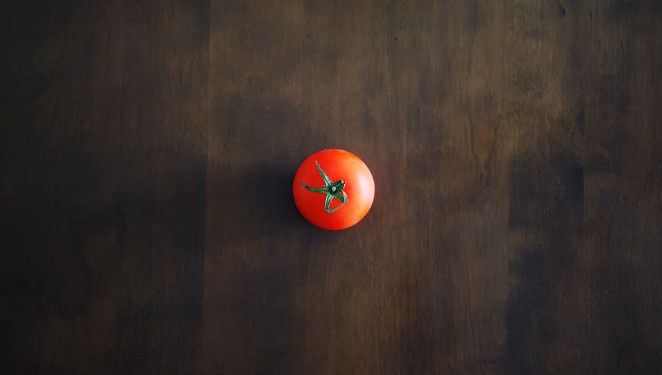 960x544 Wallpaper minimalism, tomato, red, table, wall, shadow, background