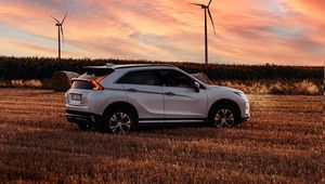 Preview wallpaper mitsubishi eclipse cross, mitsubishi, vehicle, suv, white, field, sunset