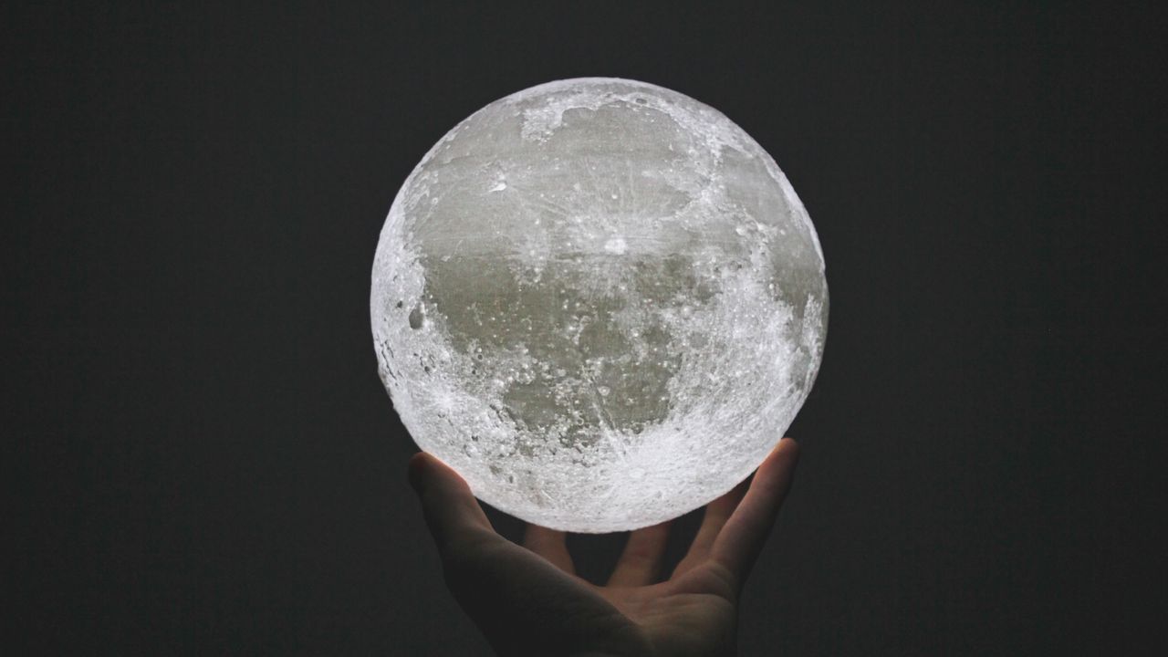 Wallpaper moon, ball, hand, sphere, glow