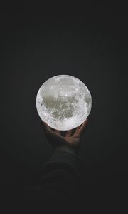 Preview wallpaper moon, ball, hand, sphere, glow
