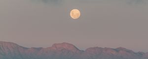 Preview wallpaper moon, mountains, fog, sea, evening