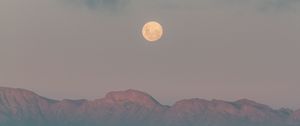 Preview wallpaper moon, mountains, fog, sea, evening