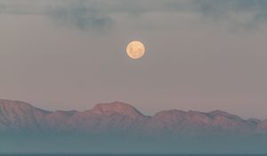 Preview wallpaper moon, mountains, fog, sea, evening