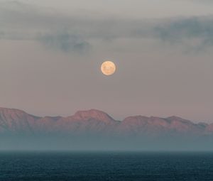 Preview wallpaper moon, mountains, fog, sea, evening