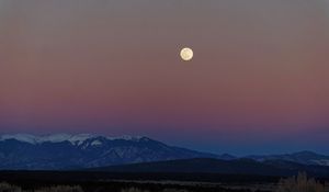 Preview wallpaper moon, mountains, snowy, field, evening