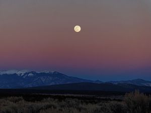 Preview wallpaper moon, mountains, snowy, field, evening
