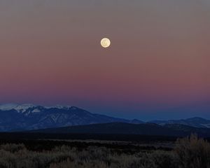 Preview wallpaper moon, mountains, snowy, field, evening