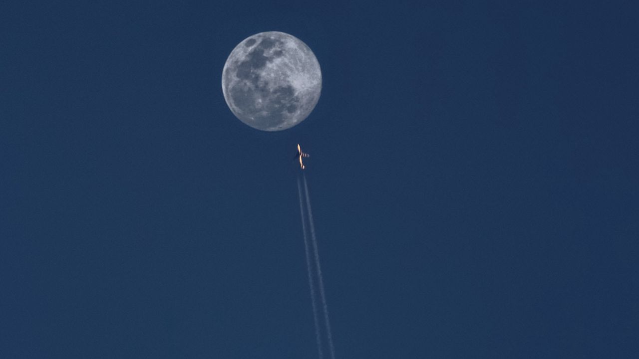 Wallpaper moon, plane, trail, sky