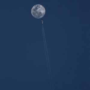 Preview wallpaper moon, plane, trail, sky