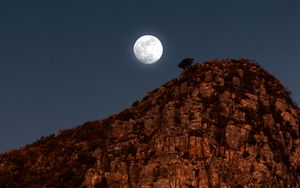 Preview wallpaper moon, rocks, mountains, night, full moon