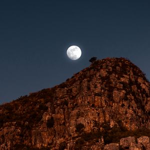 Preview wallpaper moon, rocks, mountains, night, full moon