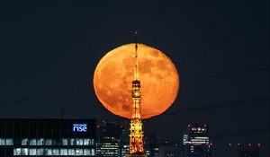 Preview wallpaper moon, tower, buildings, city, lights, night