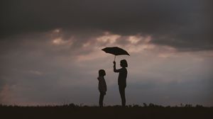 Preview wallpaper mother, child, care, umbrella, silhouettes, sky