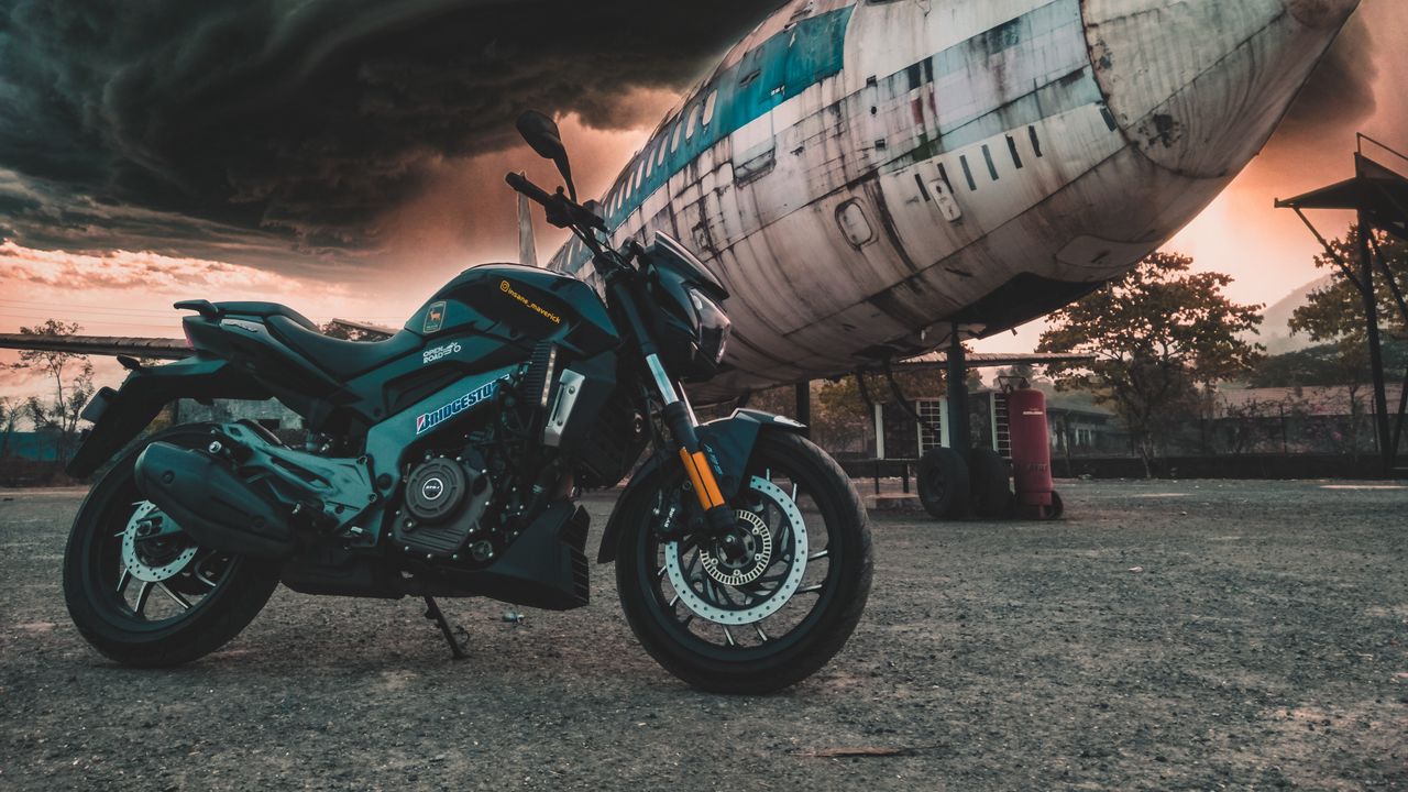 Wallpaper motorcycle, airplane, side view, clouds, overcast