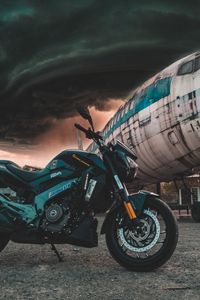 Preview wallpaper motorcycle, airplane, side view, clouds, overcast