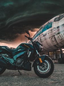 Preview wallpaper motorcycle, airplane, side view, clouds, overcast