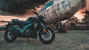 Preview wallpaper motorcycle, airplane, side view, clouds, overcast