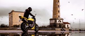 Preview wallpaper motorcycle, bike, biker, tower, water, reflection