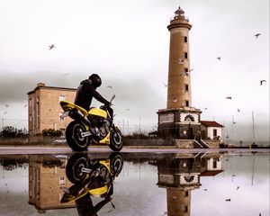 Preview wallpaper motorcycle, bike, biker, tower, water, reflection