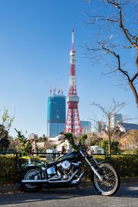Preview wallpaper motorcycle, bike, black, buildings, tower